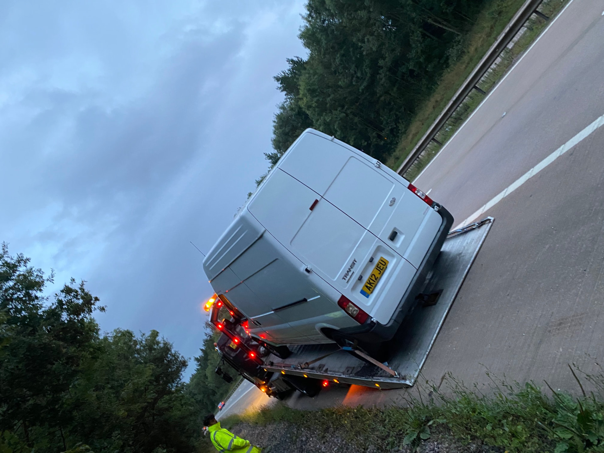 Van loaded on a recovery vehicle